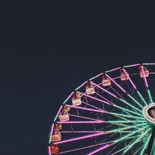 Photo of Ferris Wheel with Neon Lights at Night