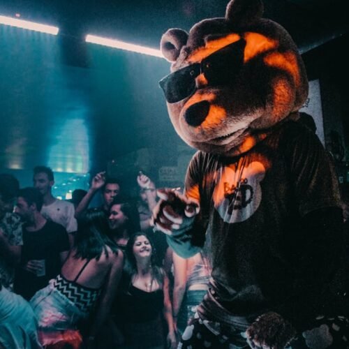 Person Wearing Bear Mask Dancing on Stage